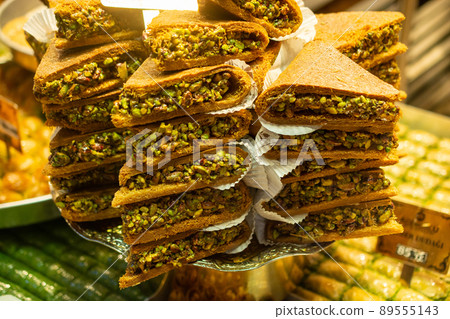 Traditional Turkish dessert kadayif. Shredded dough baked in syrup with crushed nuts 89555143