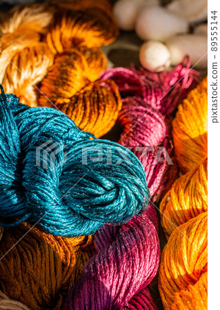 Skeins of colorful silk thread for weaving, embroidery and needlework 89555144