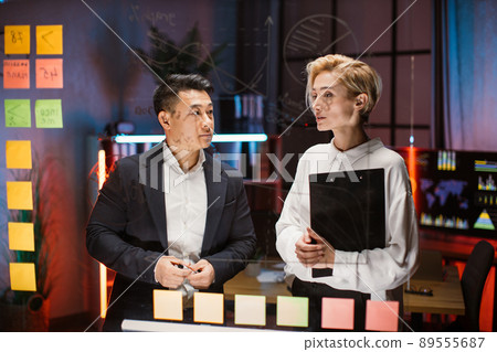 Diverse employees working together on new startup Diverse employees working together on new startup 89555687