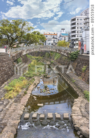 [Kyushu / Nagasaki] Ichiran bridge across the Nakashima River in Kojiyamachi and a gray heron taking a break. 89555918