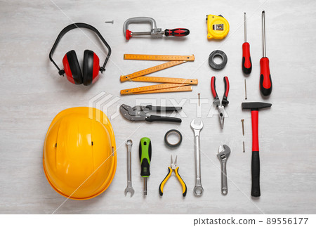 Flat lay composition with different construction tools on light background Flat lay composition with different construction tools on light background 89556177