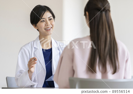 Young female doctor interviewing Young female doctor interviewing 89556514