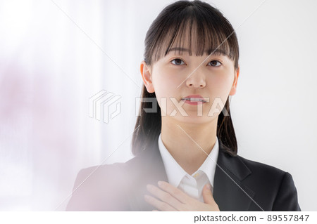 Job hunting woman who is nervous with her hand on her chest 89557847