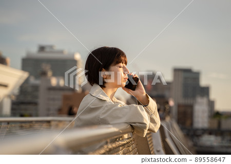 Woman talking outdoors Woman talking outdoors 89558647