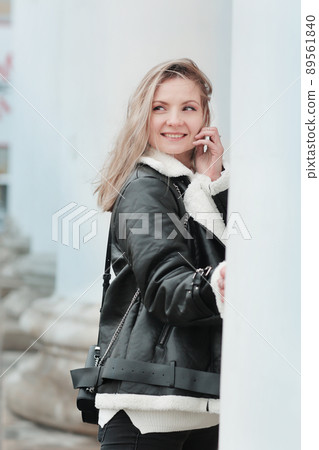blond girl with long hair in black leather jacket closeup street portrait blond girl with long hair in black leather jacket closeup street portrait 89561840
