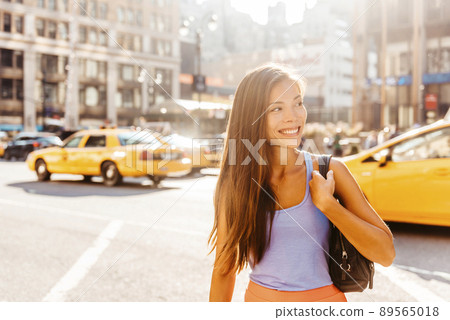 New York City Life. Young professional multiracial woman walking in Manhattan in Summer 89565018