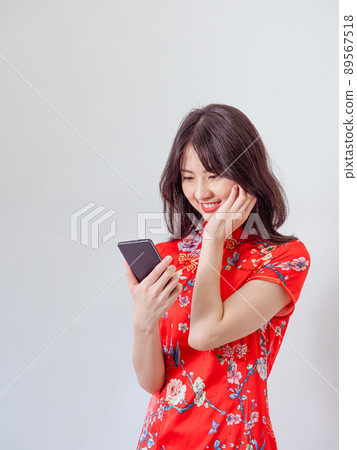 A wisdom-type handset used in front of a white background. 89567518