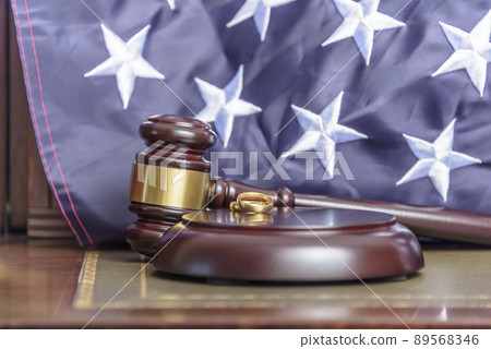 Family Law. Desktop photograph of law firm specialising in family law with the united states flag in the background. Family Law. Desktop photograph of law firm specialising in family law with the united states flag in the background. 89568346