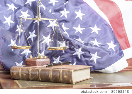 Family Law. Desktop photograph of law firm specialising in family law with the united states flag in the background. Family Law. Desktop photograph of law firm specialising in family law with the united states flag in the background. 89568348