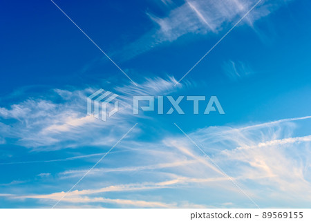 Feather clouds on deep blue sky background Feather clouds on deep blue sky background 89569155