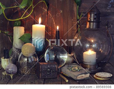 Wicca, esoteric and occult still life with vintage magic objects on witch table altar for mystic rituals and fortune telling. Halloween and gothic concept Wicca, esoteric and occult still life with vintage magic objects on witch table altar for mystic rituals and fortune telling. Halloween and gothic concept 89569308