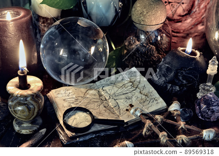 Wicca, esoteric and occult still life with vintage magic objects on witch table altar for mystic rituals and fortune telling. Halloween and gothic concept Wicca, esoteric and occult still life with vintage magic objects on witch table altar for mystic rituals and fortune telling. Halloween and gothic concept 89569318