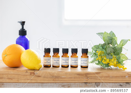 Aroma oil bottle and fruit (orange and lemon) 89569537