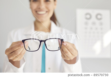 Woman doctor recommend eye glasses for client 89570730