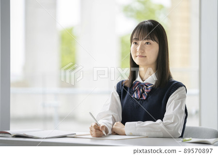 Image of female students taking classes Image of female students taking classes 89570897