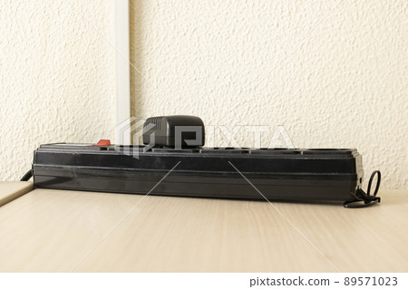 Power supply for various devices on wooden table Power supply for various devices on wooden table 89571023