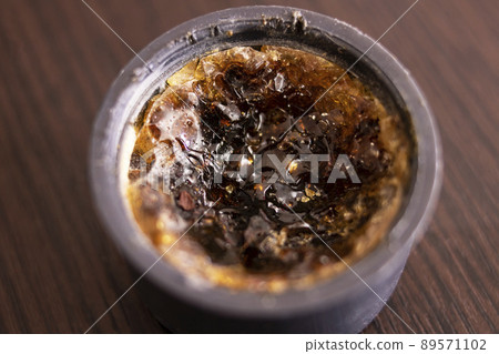 Rosin in a jar on a wooden table Rosin in a jar on a wooden table 89571102