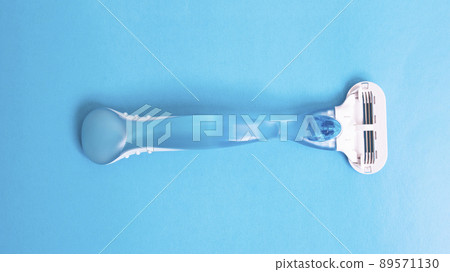 Womens blue razor on a blue background Womens blue razor on a blue background 89571130