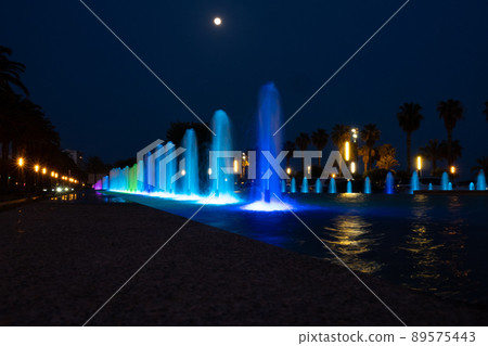 Beautiful colored fountain in the night city. 89575443