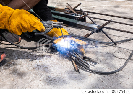 Welding work outdoors in a private house close-up. 89575464