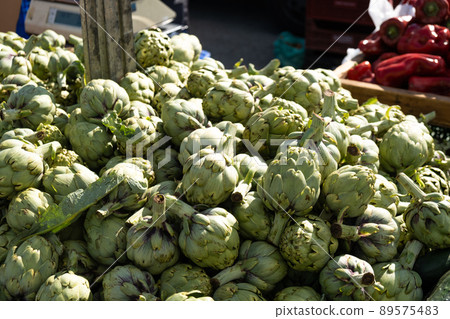 Artichoke in boxes at the bazaar close-up. 89575483