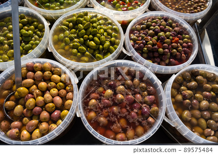Pickled olives of different varieties at the bazaar. Pickled olives of different varieties at the bazaar. 89575484