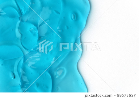 Texture of transparent antiseptic gel with air bubbles on white background. Concept of skin moisturizing, cosmetics and prevention of virus. Liquid beauty product closeup. Backdrop, flat lay Texture of transparent antiseptic gel with air bubbles on white background. Concept of skin moisturizing, cosmetics and prevention of virus. Liquid beauty product closeup. Backdrop, flat lay 89575657