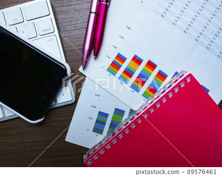 Business image of graphs, personal computers, glasses, notebooks (female) 89576461
