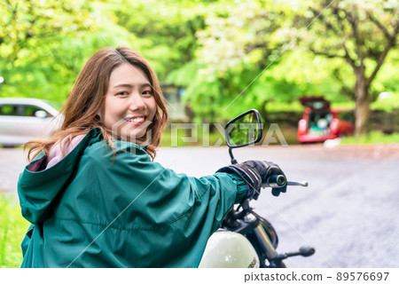 Rainy day touring bike girls smile 89576697