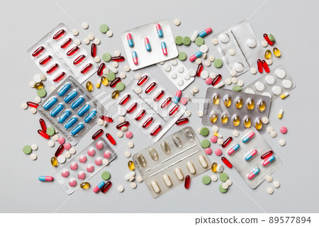 Protective face masks or surgical masks, medicine pills and thermometer on table background. Coronavirus disease. Corona virus concept. Space for text 89577894