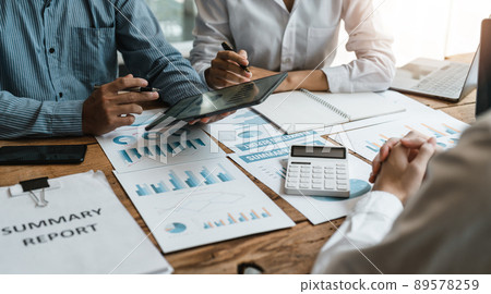 Asian business adviser meeting to analyze and discuss the situation on the financial report in the meeting room.Investment Consultant, Financial advisor and accounting concept 89578259