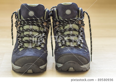 New fashionable hiking mountain boots. Modern leather trekking footware. New fashionable hiking mountain boots. Modern leather trekking footware. 89580936