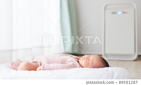 Baby taking a nap Newborn air purifier 89581287