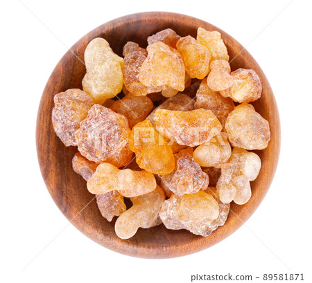 Frankincense resin in wooden bowl, isolated on white background. Pile of natural frankincense Olibanum. Incense. Top view. 89581871