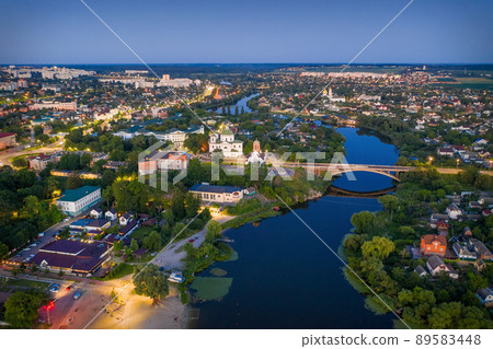 Beautiful evening top view of the city. Evening, night illumination in the city. 89583448