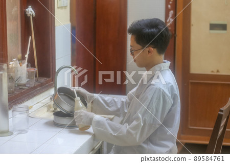 Asian man scientist make sediment experiment with sieve shakers in the laboratory 89584761