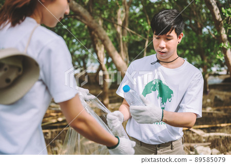 Group of asian diverse people volunteer teamwork ,environment conservation,volunteer help to picking plastic and foam garbage on park area.Volunteering world environment day. Group of asian diverse people volunteer teamwork ,environment conservation,volunteer help to picking plastic and foam garbage on park area.Volunteering world environment day. 89585079