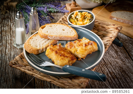 Pieces of fried cod fillet. Pieces of fried cod fillet. 89585261