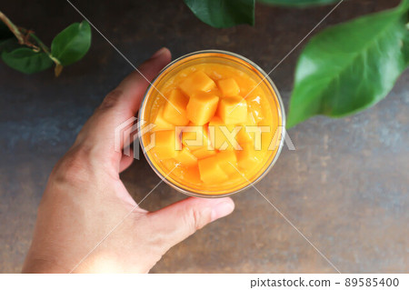 mango smoothie or mango yogurt smoothie , blended mango 89585400