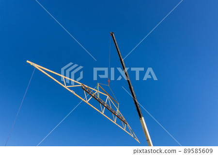 Beams roof frame an crane holds on trusses framed building construction 89585609