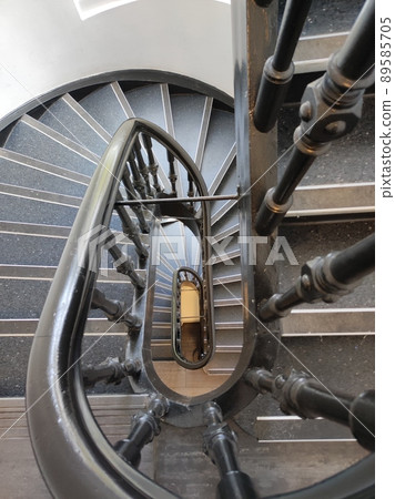 Spiral stairs in 19th century building 89585705