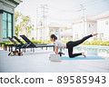 Happy asian woman stretching exercise and yoga workout in the morning at home 89585943