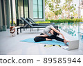 Happy asian woman stretching exercise and yoga workout in the morning at home 89585944