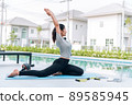 Happy asian woman stretching exercise and yoga workout in the morning at home 89585945