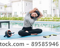 Happy asian woman stretching exercise and yoga workout in the morning at home 89585946