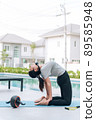 Happy asian woman stretching exercise and yoga workout in the morning at home 89585948