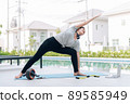 Happy asian woman stretching exercise and yoga workout in the morning at home 89585949