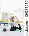 Happy asian woman stretching exercise and yoga workout in the morning at home 89585950