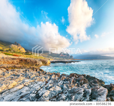 Fabulous evening seascape of Isolidda Beach near San Vito cape. Fabulous evening seascape of Isolidda Beach near San Vito cape. 89586236