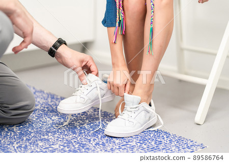 Orthopedic insole. The orthopedist works with the patient. Orthopedic clinic. Choice of insoles in an orthopedic clinic. The orthopedist offers the insole to the patient Foot care 89586764